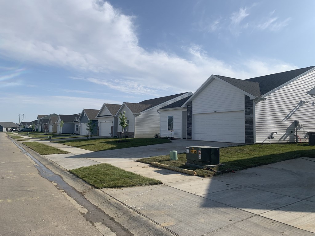 a row of houses on the side of a street